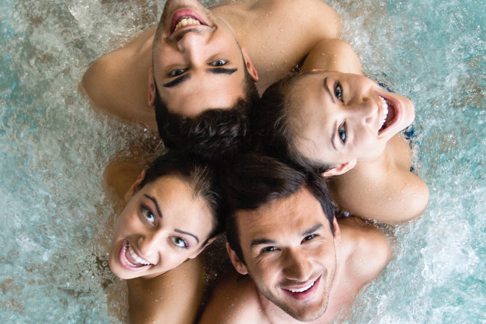 Top view picture of happy people posing in hot tub