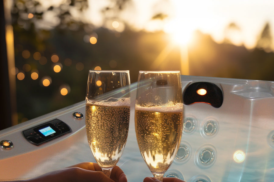couple enjoying champagne in hot tub