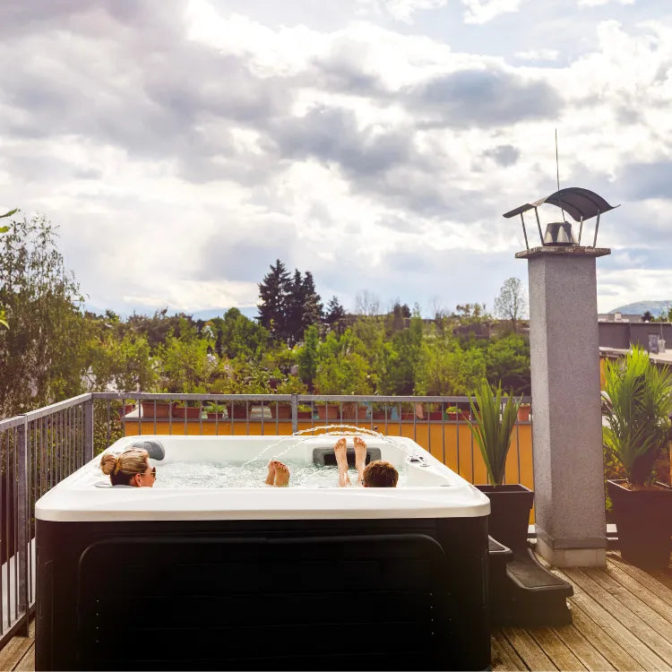 Mother and son relaxing at the family's backyard spa