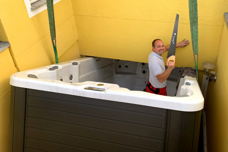 Technician working inside a hot tub