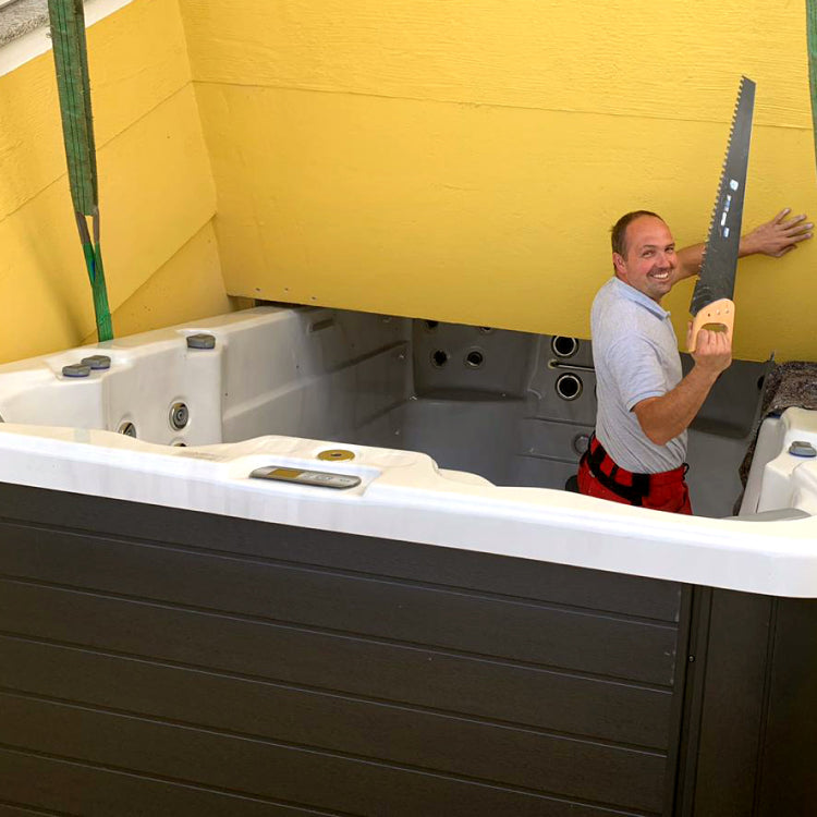 Technician working inside a hot tub