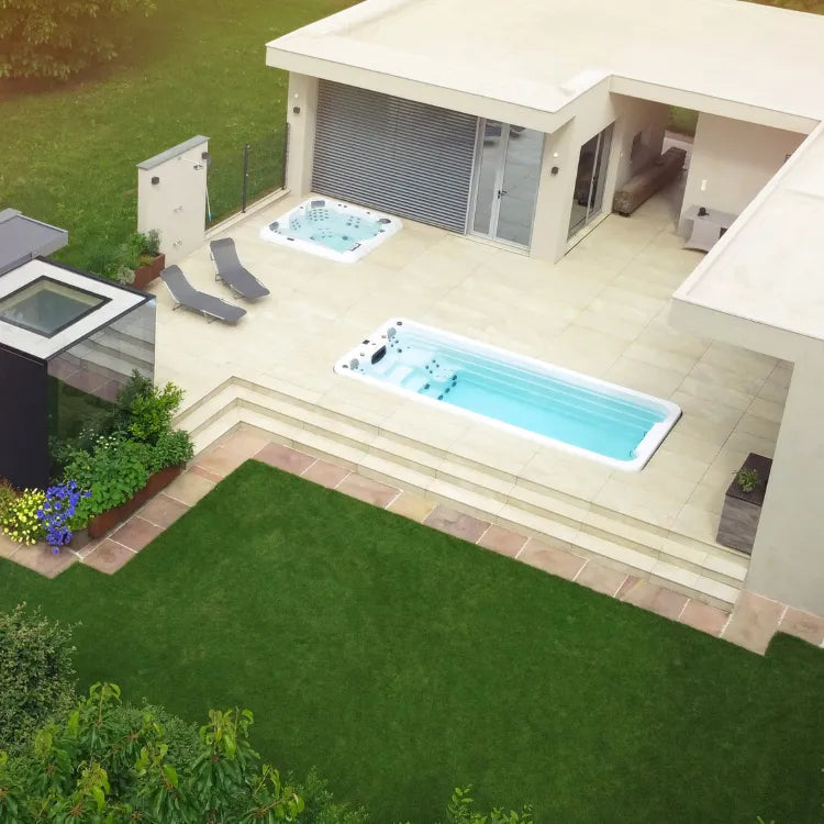 This is a modern courtyard with both a spa and a swim spa.