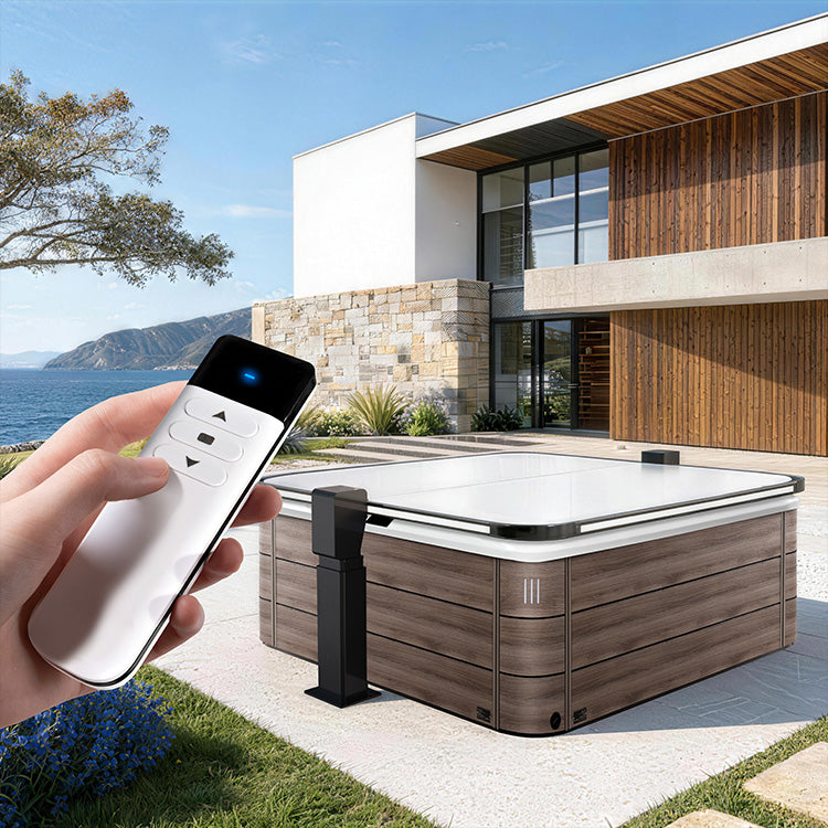 Person controlling a hot tub with a remote in front of a modern house