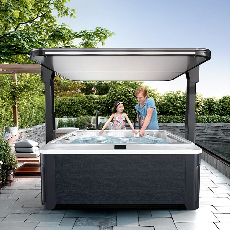 Hot tub with cover in outdoor setting with people