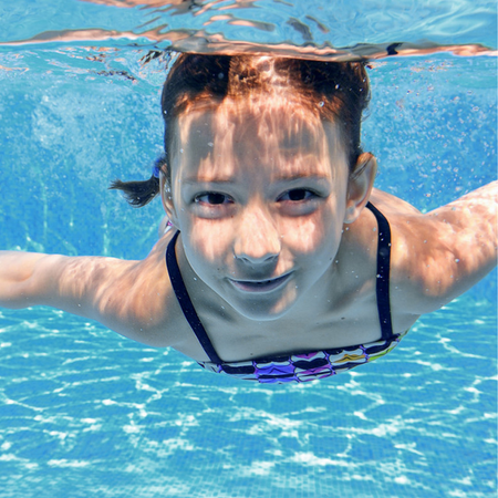 child in the clear water