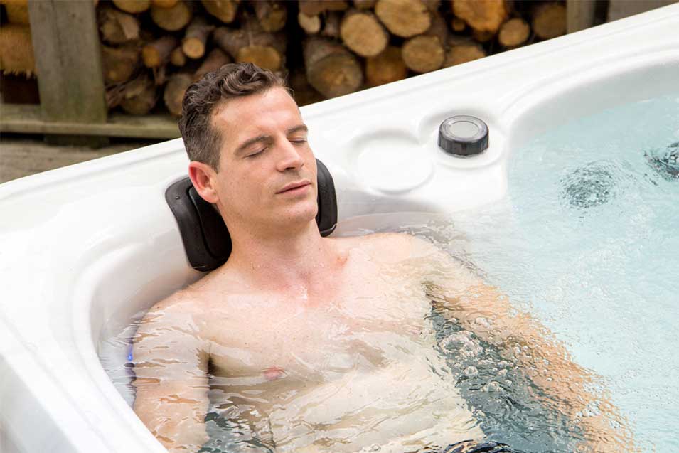 Man enjoying the ultimate comfort in hot tub Starlight