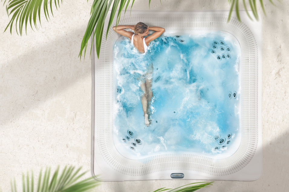 bird-eye view of a woman relaxing in the Commercial hot tub 