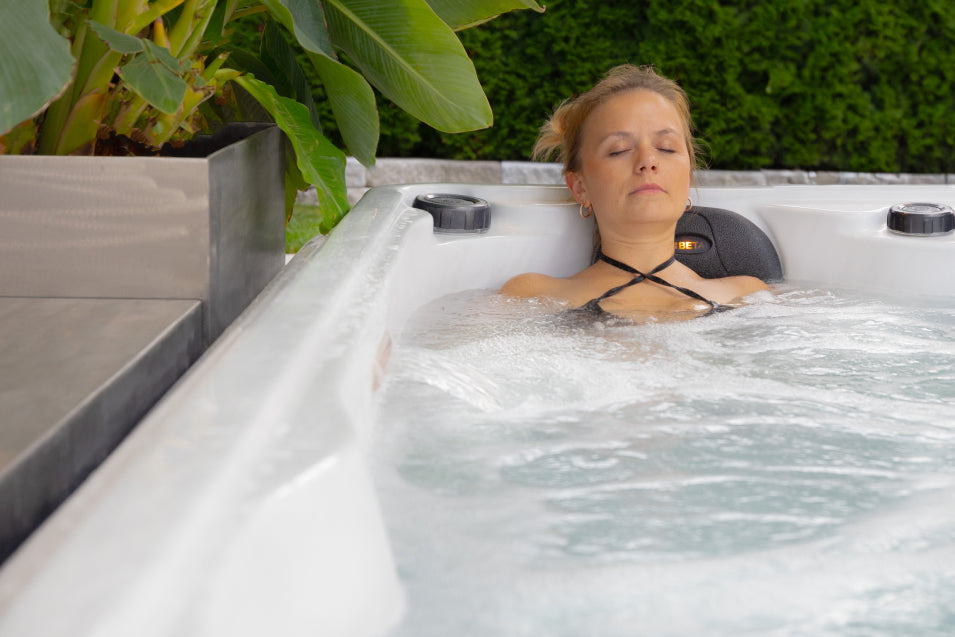 woman relaxing inside the hot tub