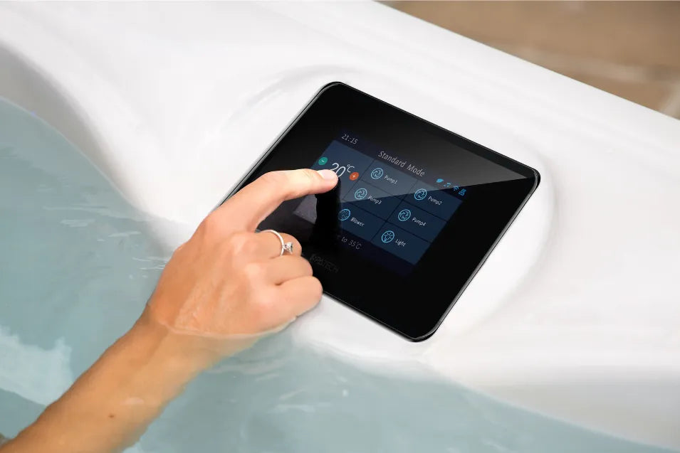 Woman hand interacting with the  spatech Infinity controller of the hot tub