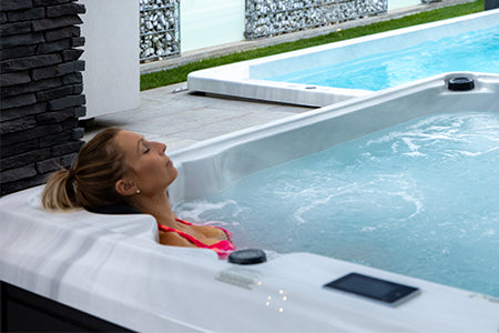 Woman enjoying the hot tub warmth.